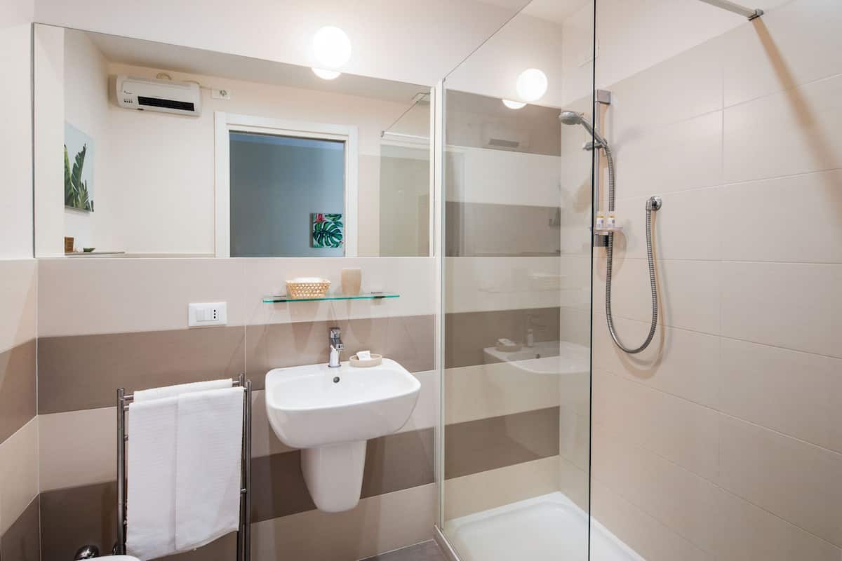 shower, free toiletries, hair dryer, dressing gowns