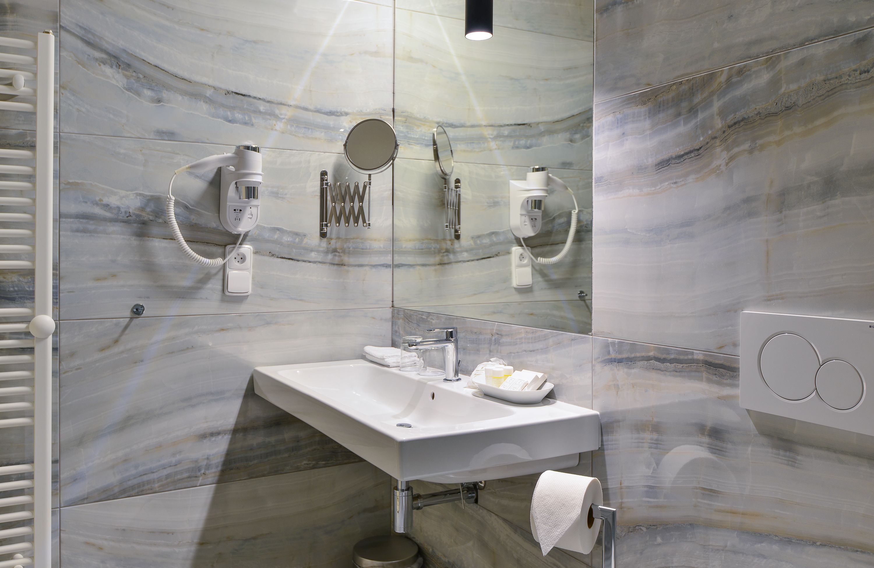 rooftop family room | bathroom | shower, designer toiletries, hair dryer, towels