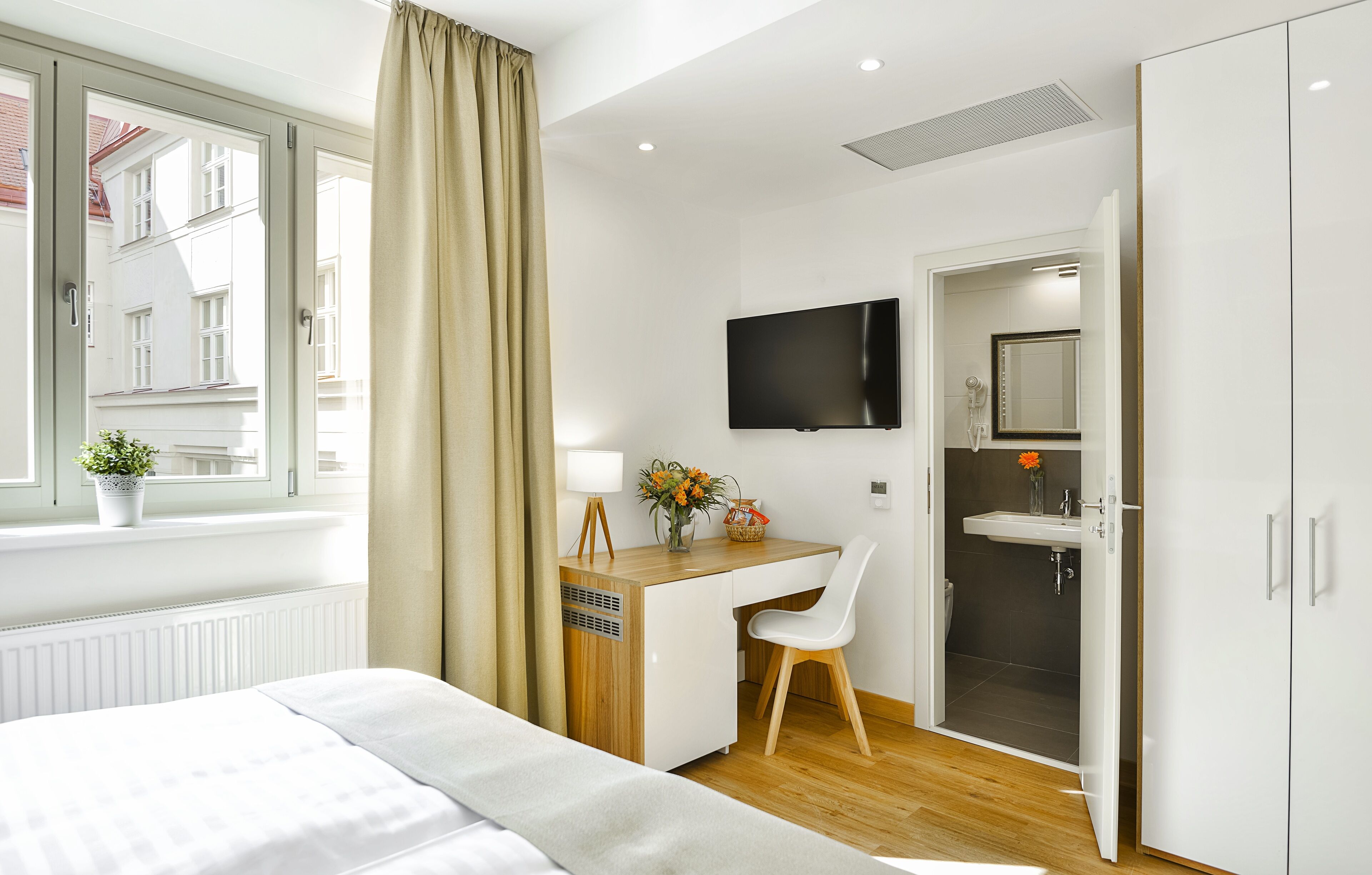 small double or twin room | minibar, in-room safe, desk, laptop workspace