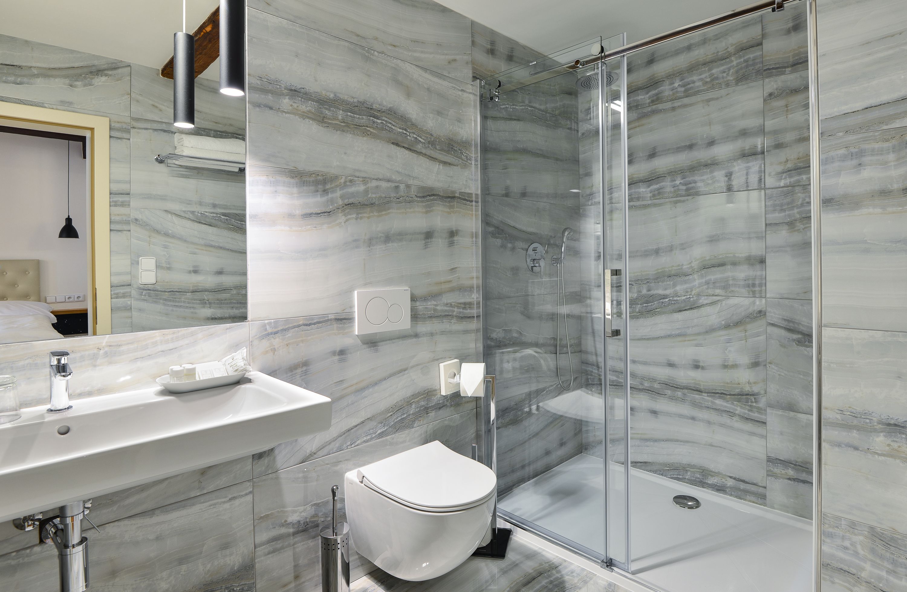 rooftop family room | bathroom | shower, designer toiletries, hair dryer, towels