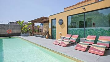 Seasonal outdoor pool, pool umbrellas, pool loungers