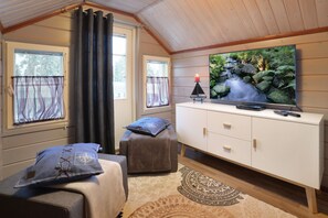 Superior Apartment 2, Sauna (Bed Linens Available for Extra Cost) | Living area | 48-inch flat-screen TV with cable channels, TV, fireplace - Vuokatin Aateli Apartments (Sotkamo)