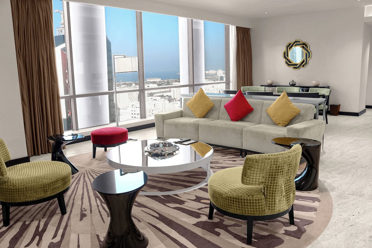 presidential suite, multiple beds | living area | 42-inch lcd tv with satellite channels, tv