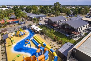 A water park with slides and pools, surrounded by residential buildings. - All Seasons Holiday Park (Mildura)