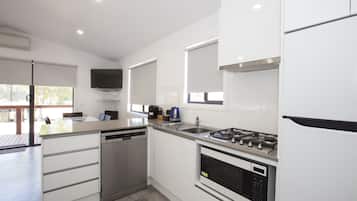 Full-size fridge, microwave, stovetop, coffee/tea maker