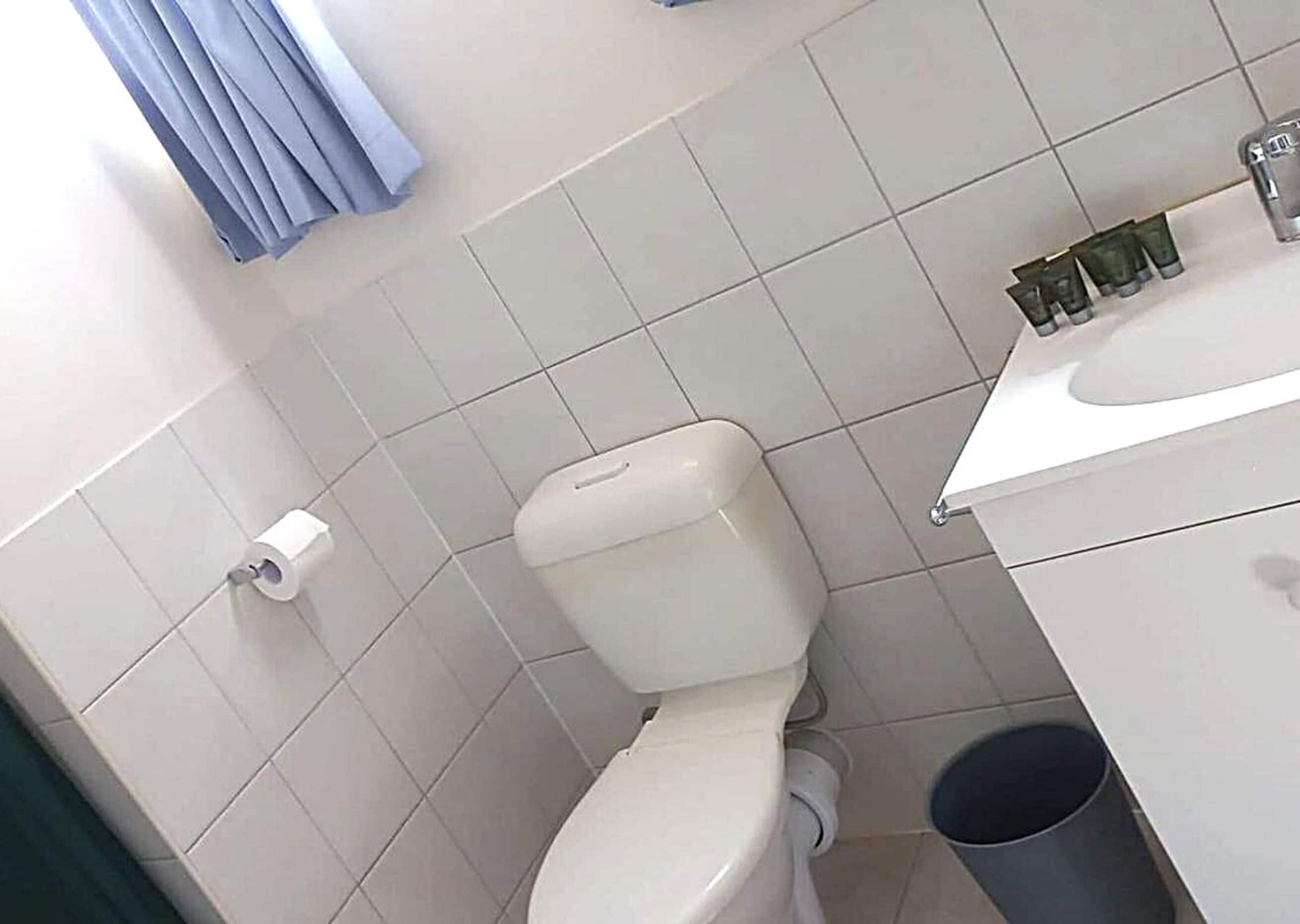 2 bedroom unit (1 queen and 3 single beds) | bathroom | shower, free toiletries, hair dryer, towels