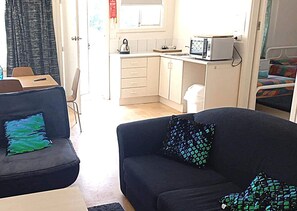 2 Bedroom Unit (1 Queen and 3 Single Beds) | Living area | Flat-screen TV
