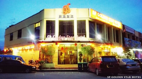Front of property – evening/night. Sp Golden Star Hotel
