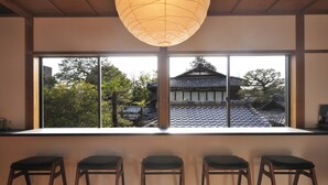 A room with a large window, wooden ceiling, and a hanging paper lantern. - Kiraku Kyoto Higashiyama (Kyoto)