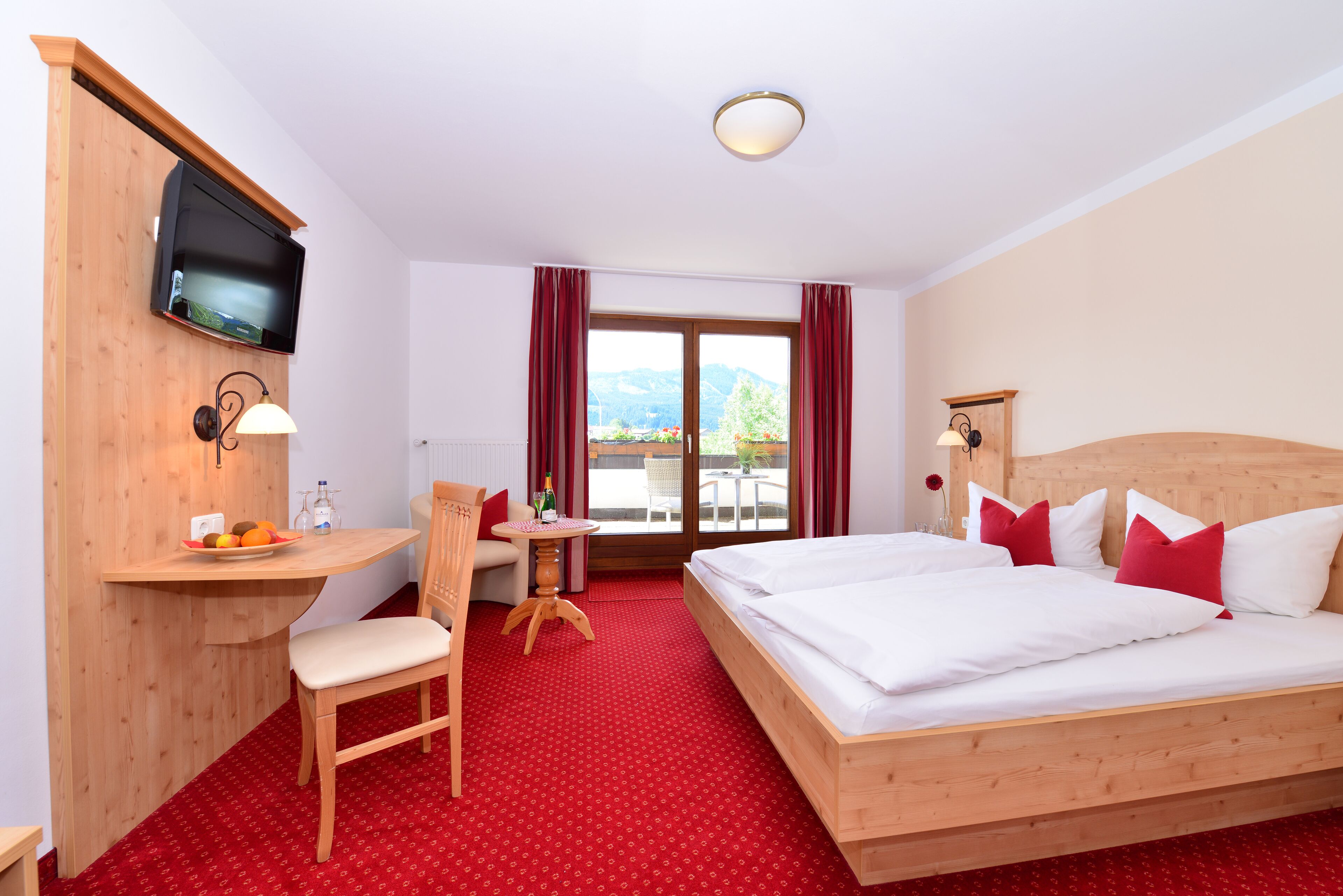 comfort double room, mountain view | in-room safe, individually decorated, individually furnished, desk