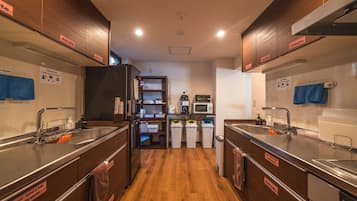 Full-size fridge, microwave, stovetop, rice cooker