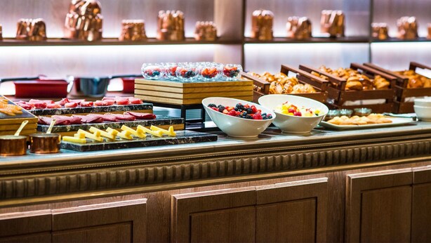 A buffet with various food items including fruits, pastries, and cheeses. - My Bade Hotel (Istanbul)