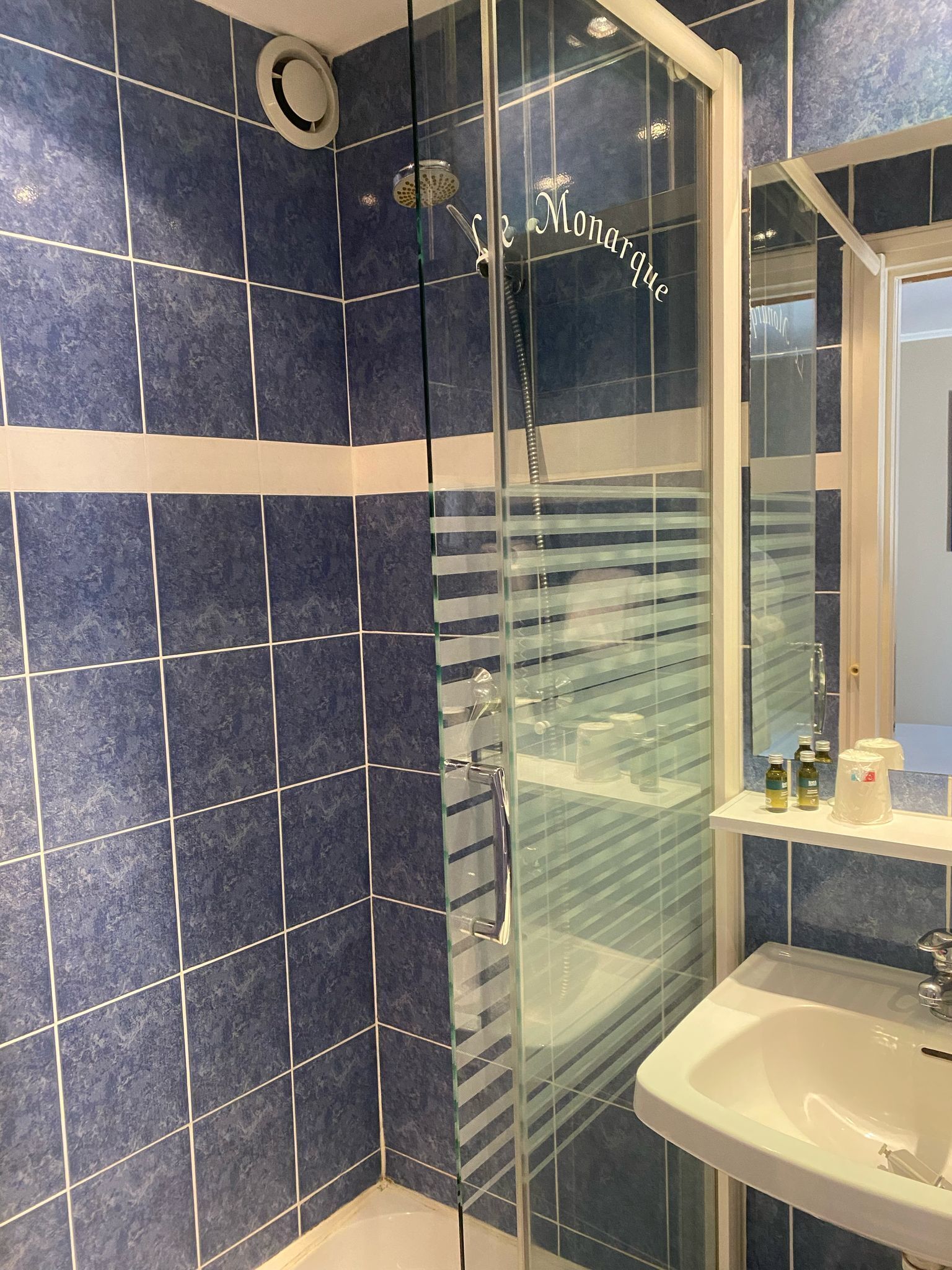 economy room | bathroom | shower, free toiletries, hair dryer, towels