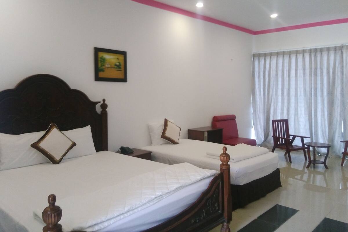Triple Bungalow, Beachfront | Minibar, in-room safe, desk, blackout curtains