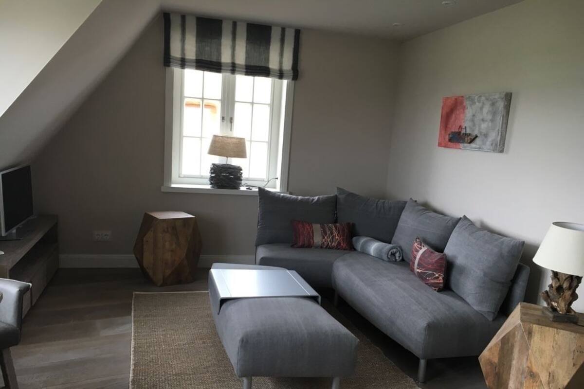 Apartment (EastSide upper floor) | Living area | Flat-screen TV