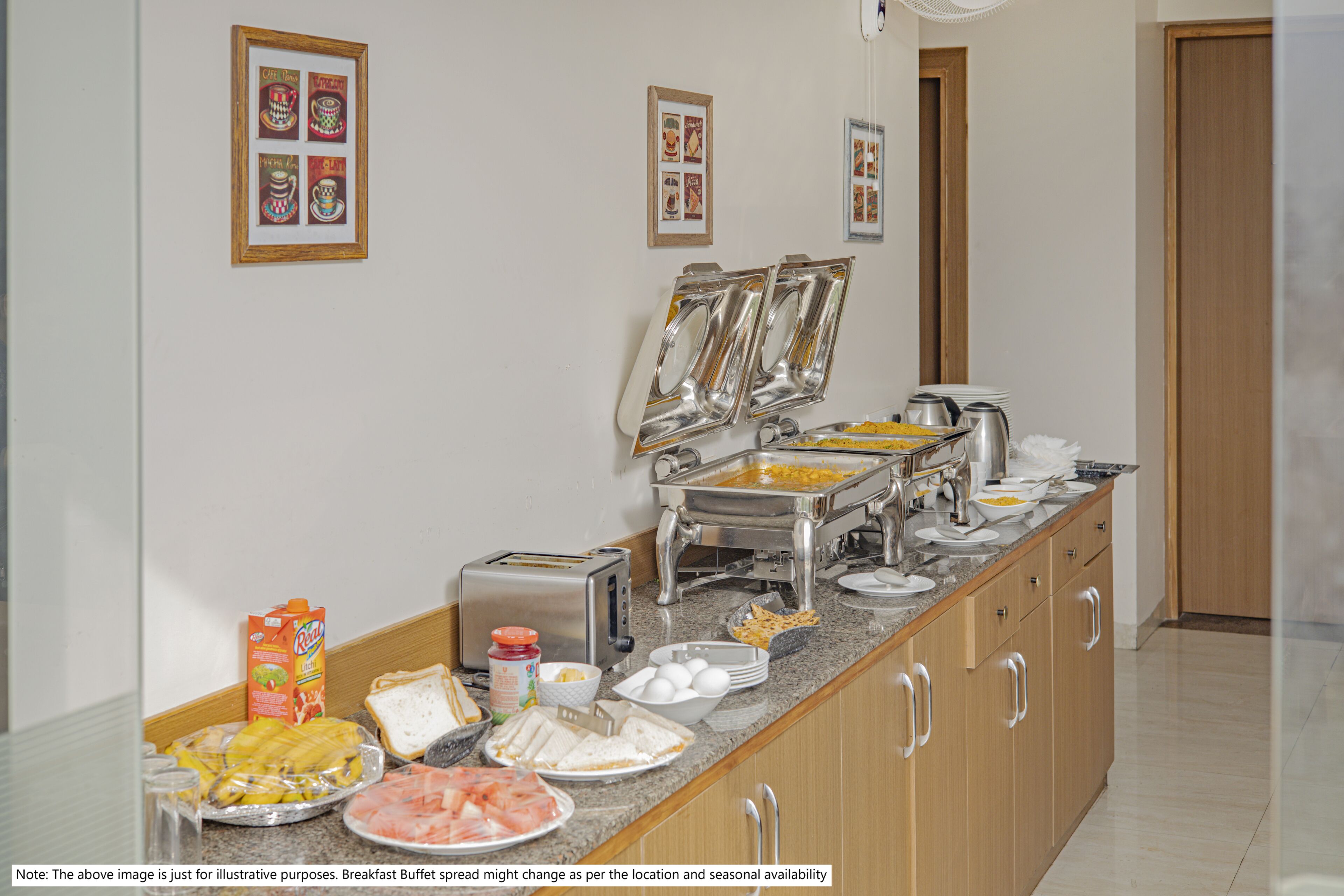 A breakfast buffet with various food items and a toaster.