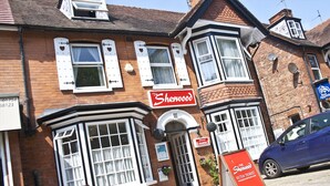 A traditional brick building with a sign reading "Sherwood." - The Sherwood (Skegness)