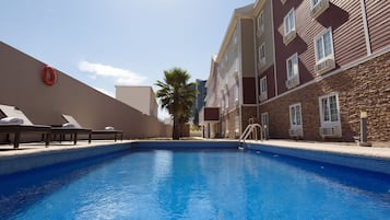 Outdoor pool, open 9:00 AM to 8:00 PM, pool umbrellas, pool loungers