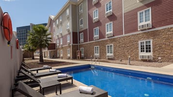 Outdoor pool, open 9:00 AM to 8:00 PM, pool umbrellas, pool loungers