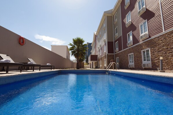 Outdoor pool, open 9:00 AM to 8:00 PM, pool umbrellas, sun loungers