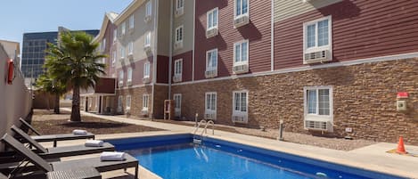 Outdoor pool, open 9 AM to 8:00 PM, pool umbrellas, pool loungers