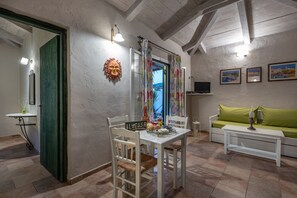 Cottage, 1 Bedroom, Partial Sea View | Living area | 24-inch flat-screen TV with satellite channels, TV - Ilyessa Cottages (Zakynthos)
