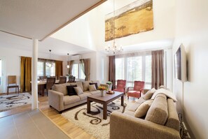 Luxury Villa, Multiple Bedrooms, Sauna (Keisari) | Living area | 50-inch flat-screen TV with cable channels, TV, fireplace - Vuokatin Aateli Villas (Sotkamo)