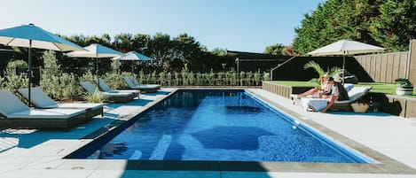 Outdoor pool, a heated pool, pool umbrellas, sun loungers