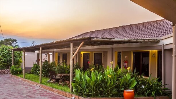 A building with a tiled roof and a covered patio area.