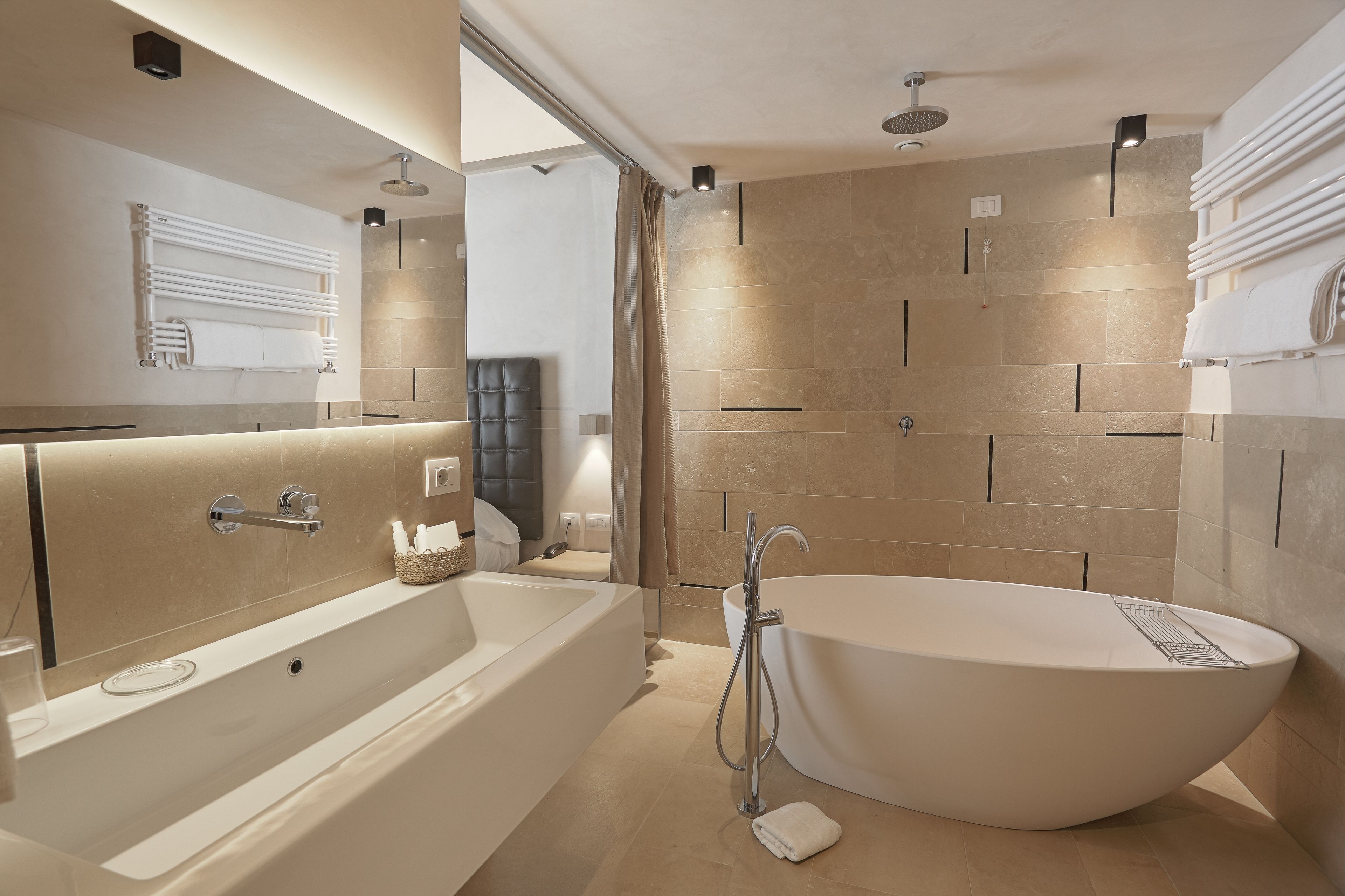 junior suite | bathroom | shower, free toiletries, hair dryer, slippers