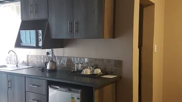 Room (Self Catering) | Private kitchenette | Fridge, microwave, coffee/tea maker, electric kettle