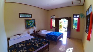 A hotel room with two beds, a window with red curtains, a fan, and a painting on the wall. - Pondok Batur Indah (Karangasem)