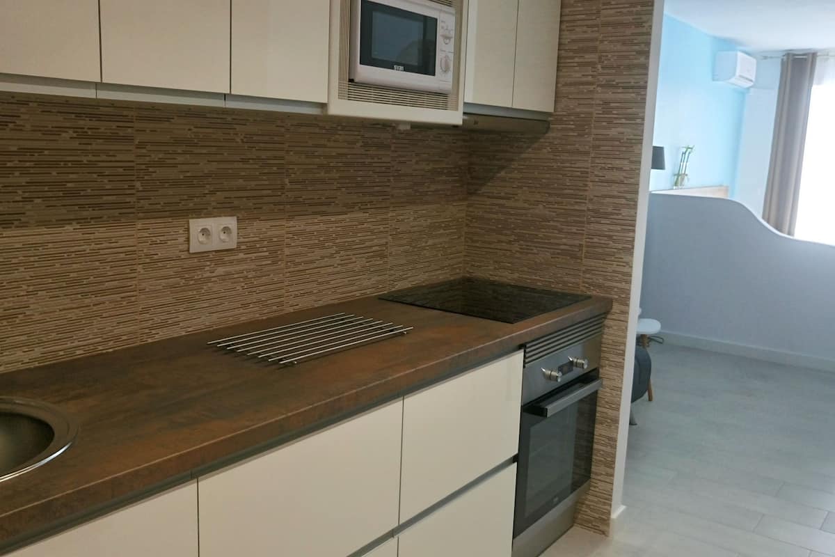 studio, pool view | private kitchen | full-sized fridge, microwave, oven, stovetop