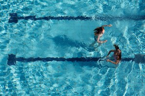 A swimming pool with clear water and lane dividers. - Harvey (Jesolo)