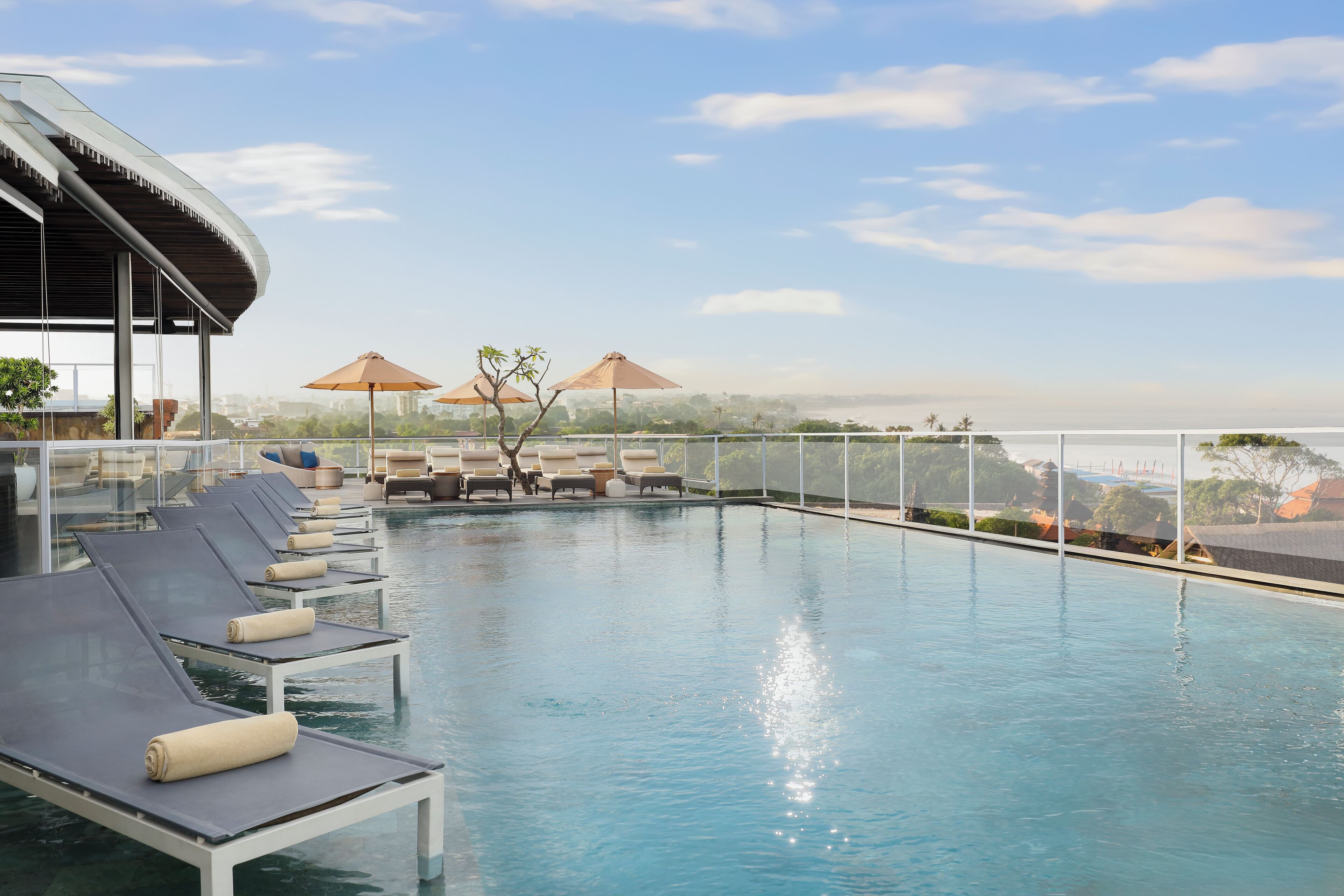 outdoor pool, pool umbrellas, pool loungers