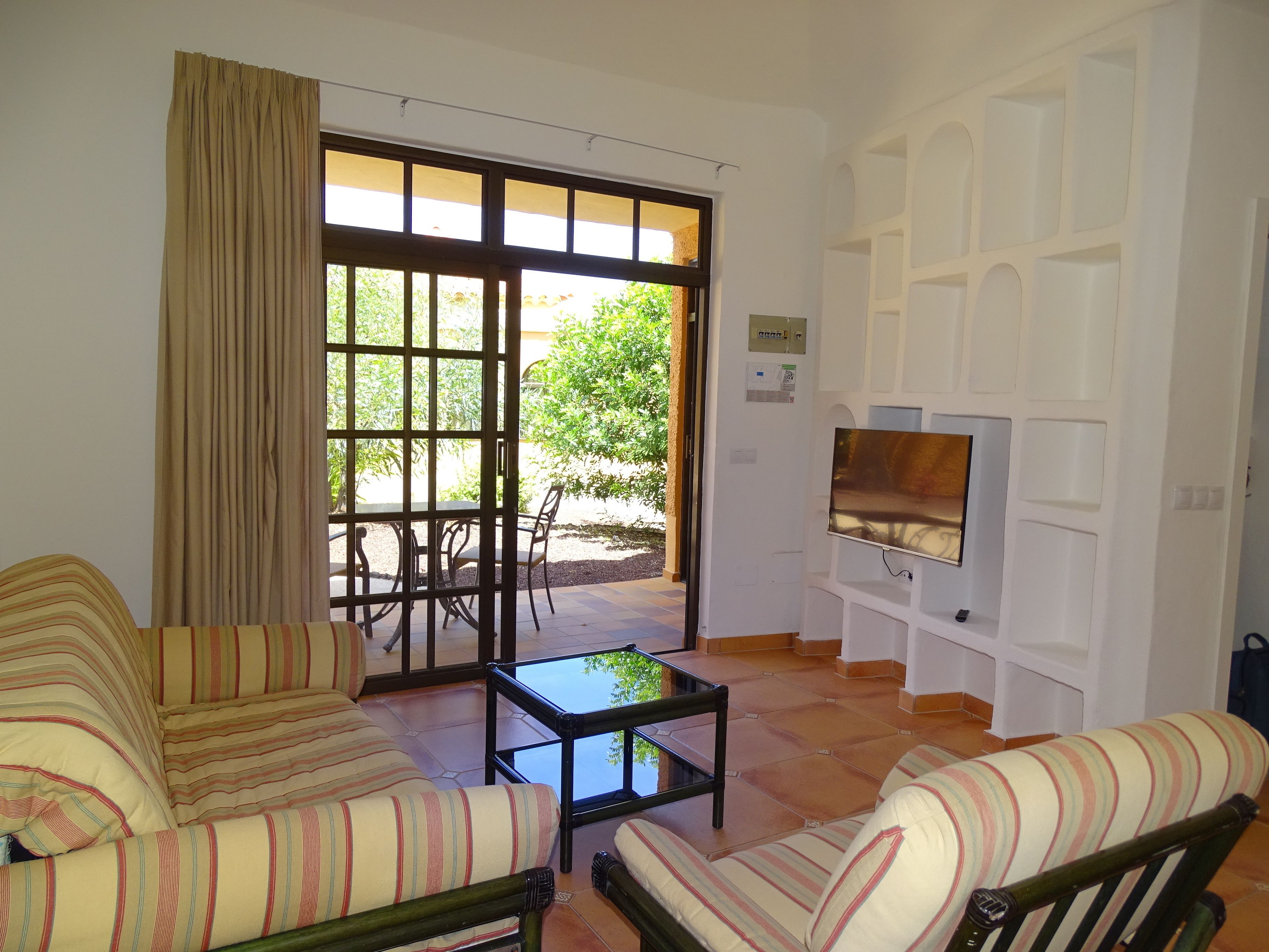 bungalow, 1 bedroom | living area | flat-screen tv