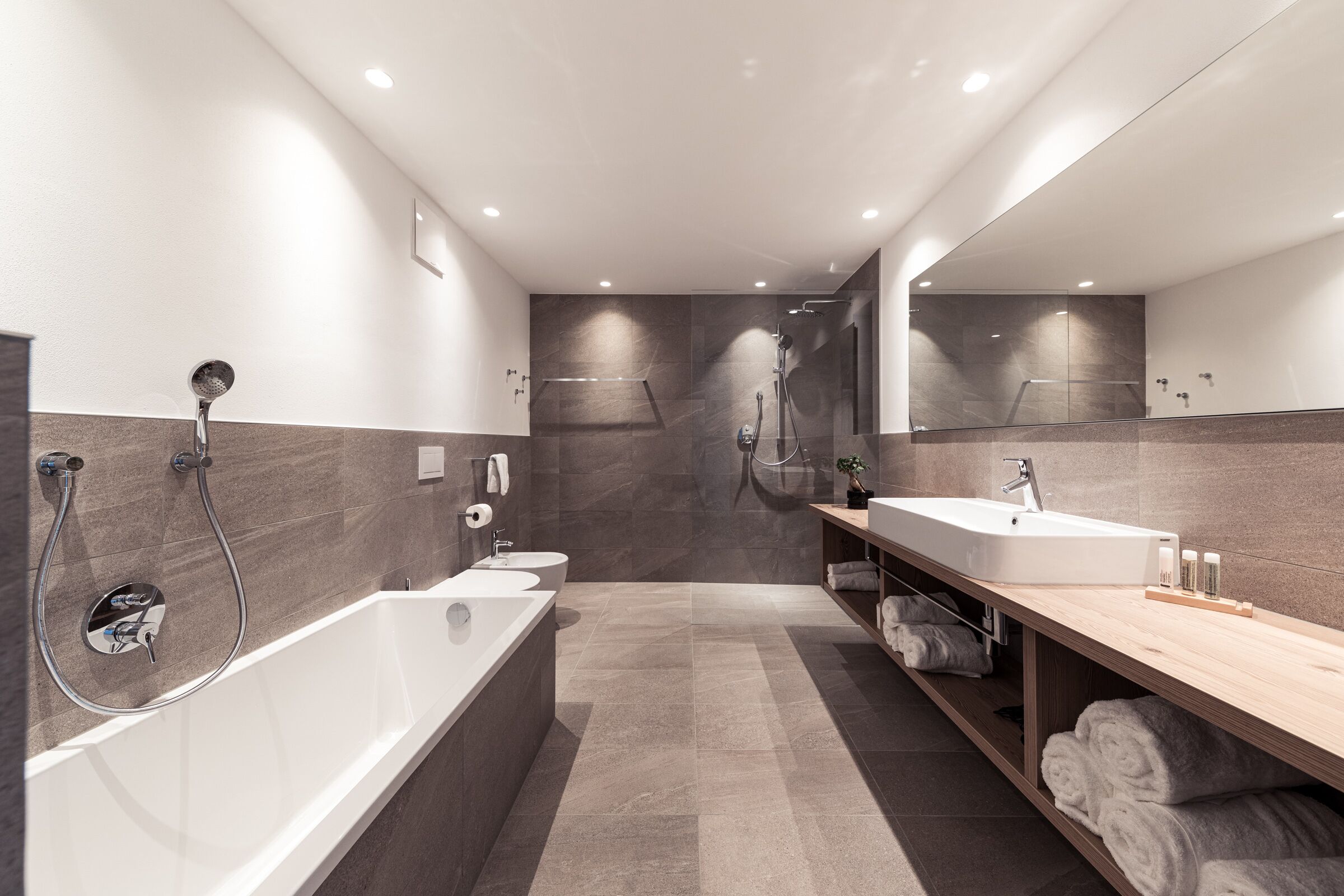 superior suite | bathroom | eco-friendly toiletries, hair dryer, bathrobes, towels