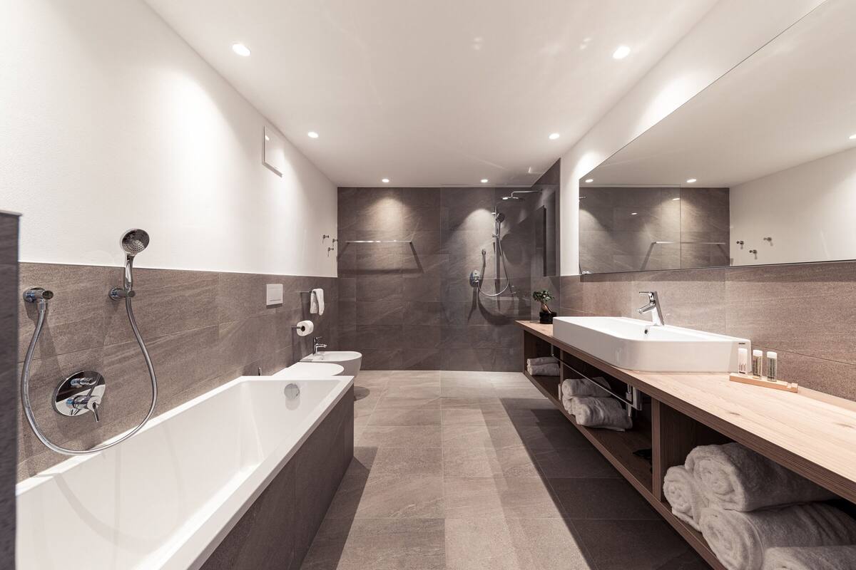 superior suite | bathroom | eco-friendly toiletries, hair dryer, bathrobes, towels