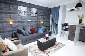 Presidential Apartment | Living area | 40-inch plasma TV with satellite channels, TV - Newland Luxury Apartments (Abuja)