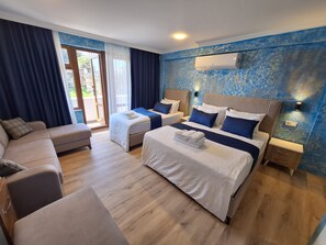 Deluxe Quadruple Room | Individually furnished, soundproofing, free WiFi, bed sheets