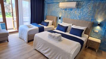 Deluxe Quadruple Room | Premium bedding, soundproofing, free WiFi, bed sheets