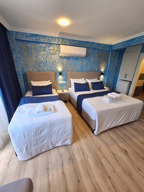 Deluxe Quadruple Room | Individually furnished, soundproofing, free WiFi, bed sheets