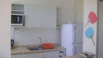 Family Apartment, 3 Bedrooms, Balcony | Private kitchen | Full-size fridge, microwave, oven, stovetop