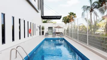 Outdoor pool, pool umbrellas, sun loungers