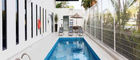 Outdoor pool, pool umbrellas, pool loungers