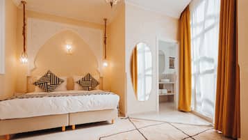 Junior Suite | 1 bedroom, premium bedding, in-room safe, individually decorated