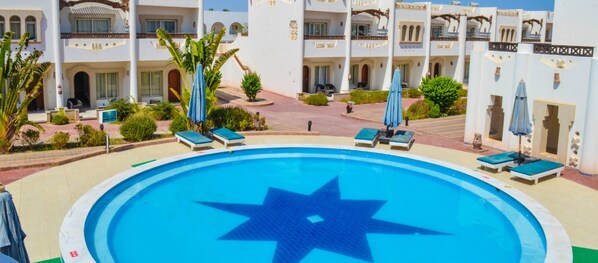 2 outdoor pools, pool umbrellas, pool loungers