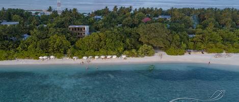 Beach nearby, white sand, sun loungers, beach umbrellas