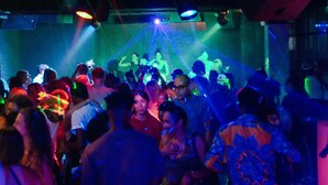 A crowded indoor space with people gathered, possibly at an event or party. - Kendwa Rocks Beach Hotel (Kendwa)