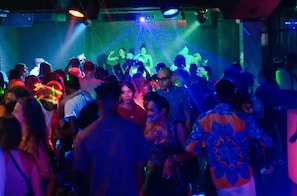 A crowded indoor space with people gathered, possibly at an event or party. - Kendwa Rocks Beach Hotel (Kendwa)